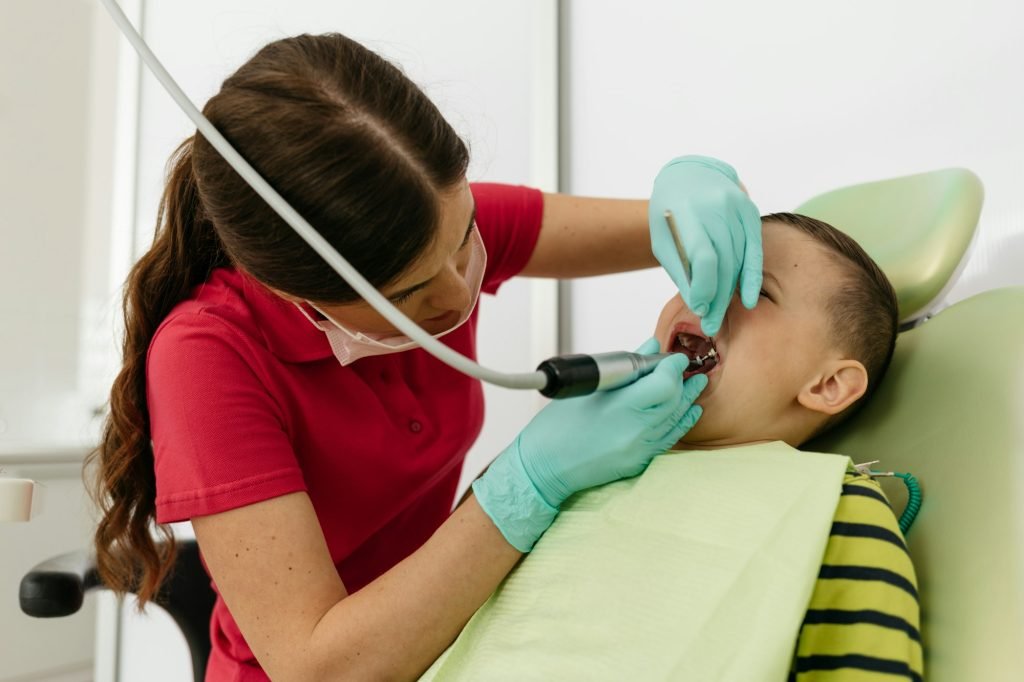 A child with a dentist in a dental office.